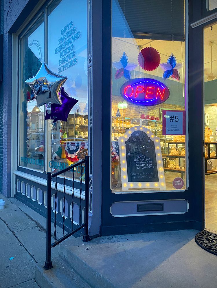 Downtown shop with an open sign in the window